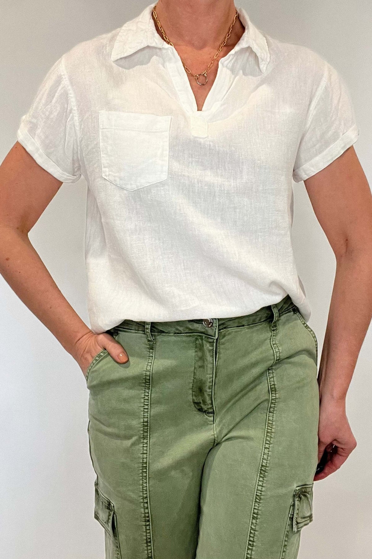 Linen blend perfection. This is your go to everything white top; layer it under a jacket, pair with pants or shorts, dress it up or dress it down but know that however you style this top you will look and feel put together.