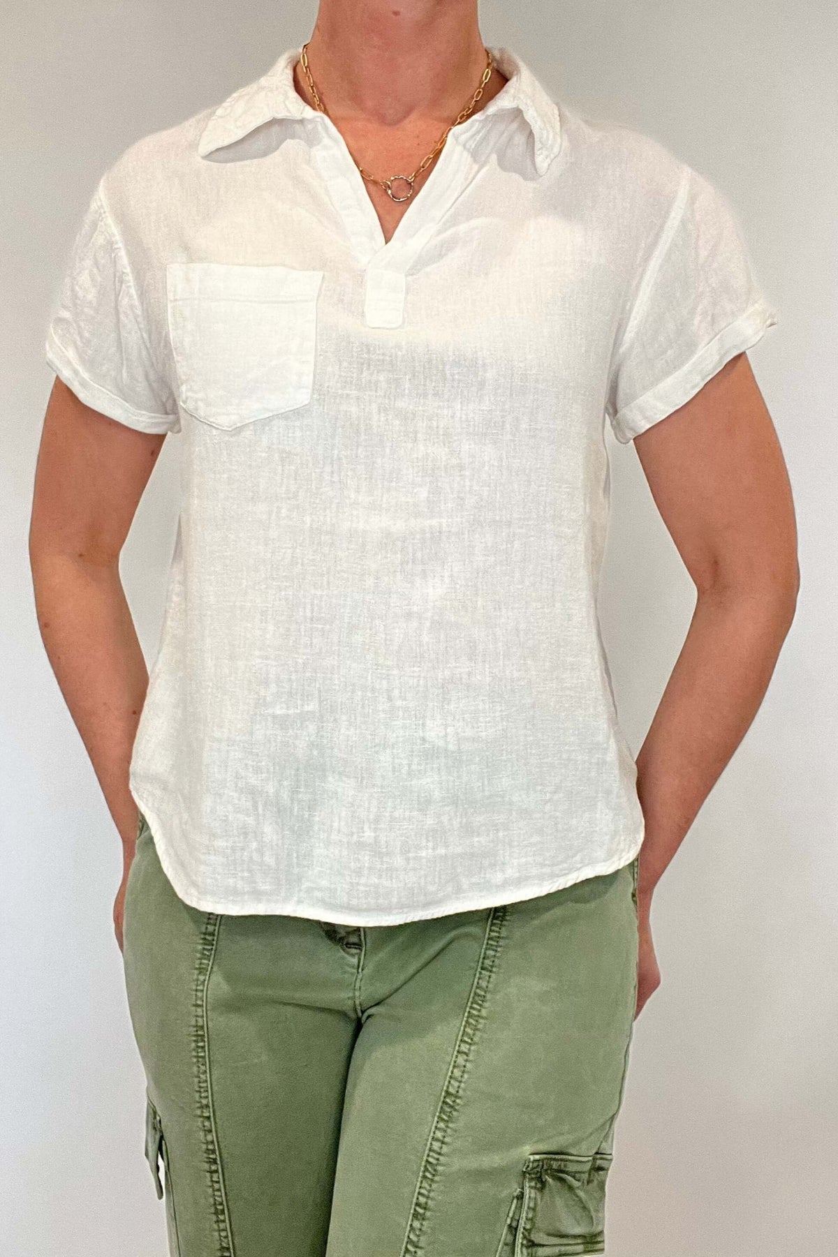 Linen blend perfection. This is your go to everything white top; layer it under a jacket, pair with pants or shorts, dress it up or dress it down but know that however you style this top you will look and feel put together.