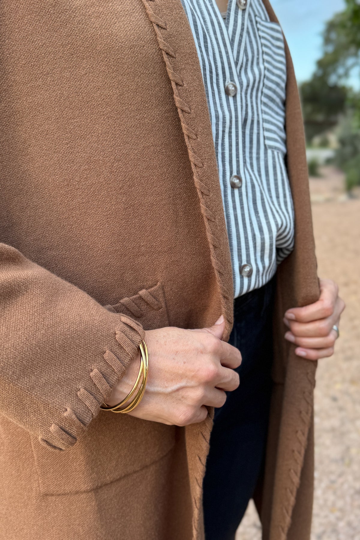 &nbsp;This long line cardigan with whipstitch detail adds a polished layer to any outfit. Soft and medium weight, it drapes beautifully while the whipstitch edging gives it a subtle, elevated touch.