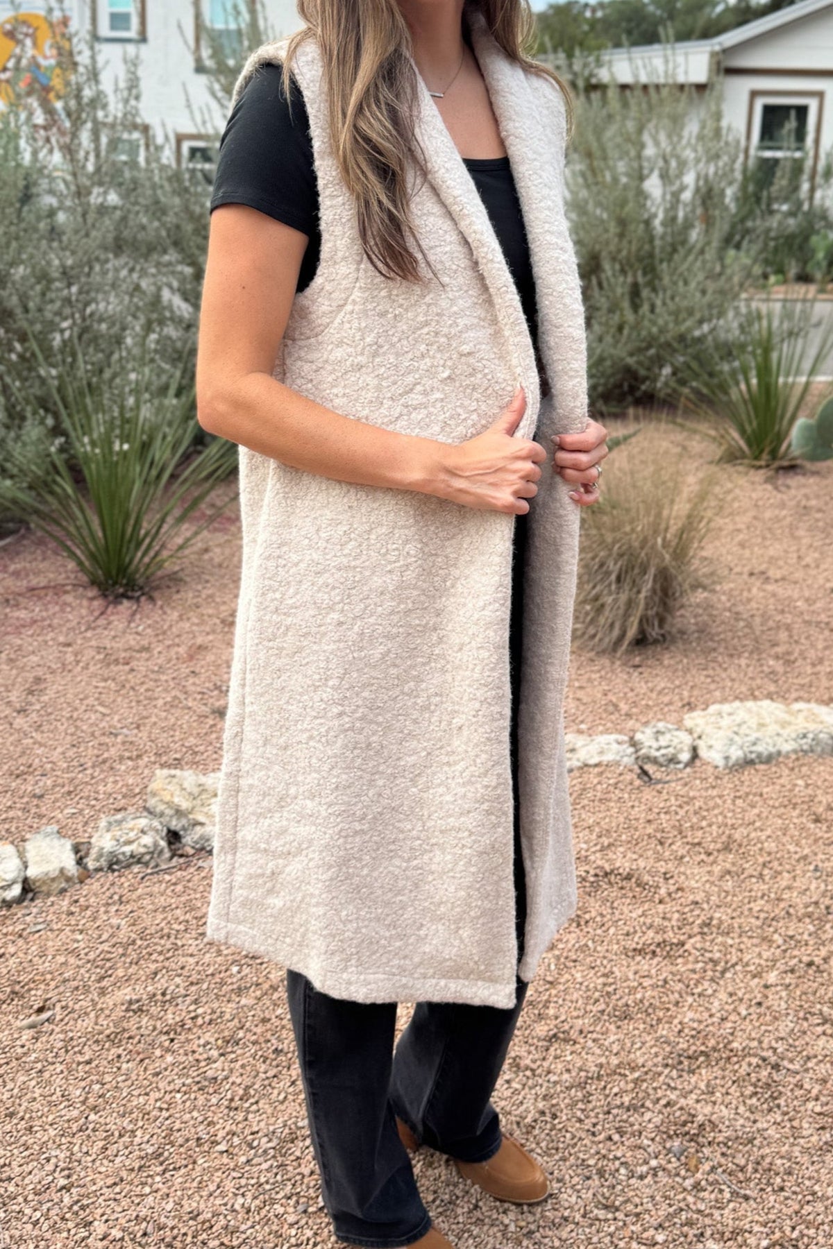 &nbsp;Polished yet effortless, the Long Line Fuzzy Vest brings a modern twist to classic layering. Designed in the same textured finish as the Bronte, it features a sleeveless silhouette with a relaxed, tailored drape, perfect for transitional weather or elevated everyday wear. The open front and single button closure make it easy to dress up or down.