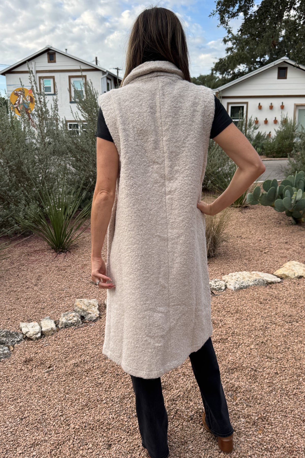 &nbsp;Polished yet effortless, the Long Line Fuzzy Vest brings a modern twist to classic layering. Designed in the same textured finish as the Bronte, it features a sleeveless silhouette with a relaxed, tailored drape, perfect for transitional weather or elevated everyday wear. The open front and single button closure make it easy to dress up or down.