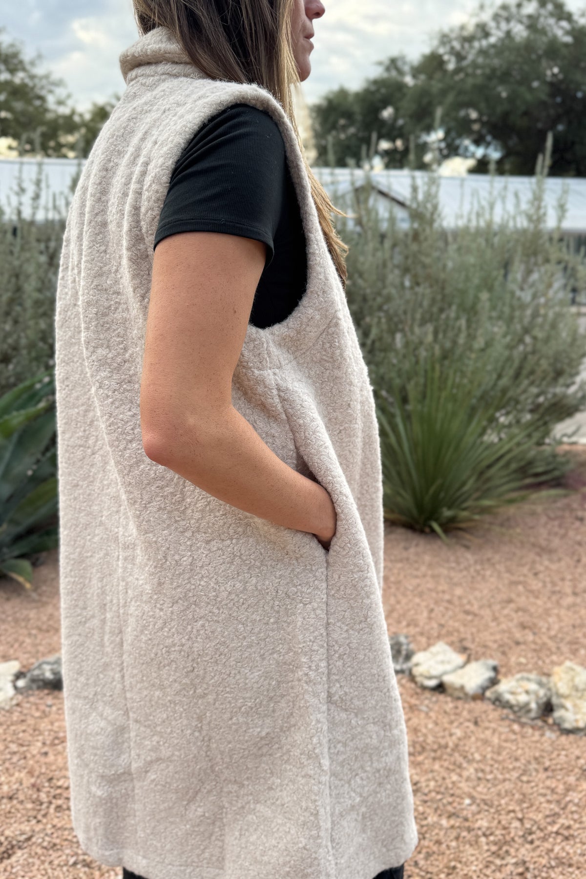 &nbsp;Polished yet effortless, the Long Line Fuzzy Vest brings a modern twist to classic layering. Designed in the same textured finish as the Bronte, it features a sleeveless silhouette with a relaxed, tailored drape, perfect for transitional weather or elevated everyday wear. The open front and single button closure make it easy to dress up or down.