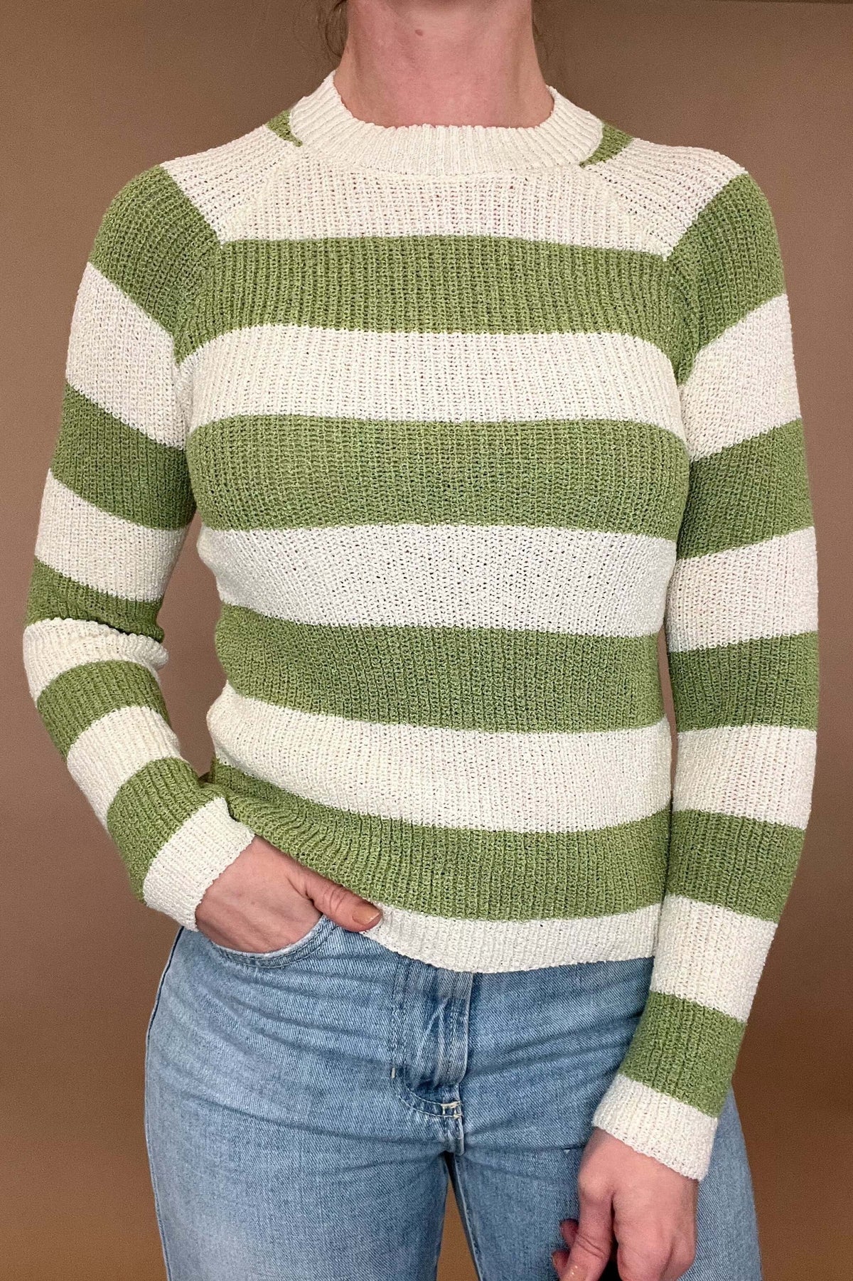 <br>Elevate your wardrobe with the Lucky Stripes Spring Sweater. This green and ecru fitting sweater features a unique texture, perfect for adding depth to your style. Ideal for layering, it provides both warmth and a touch of sophistication. Step up your fashion game with this exclusive piece.