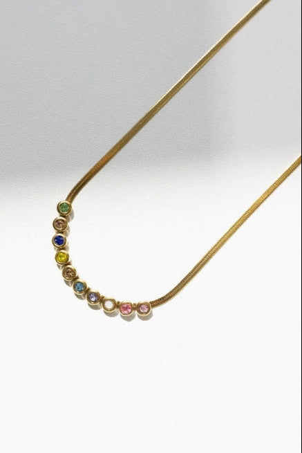Dainty and sleek with just the right pop of color, this gold necklace brings a fun yet polished touch to any outfit. The colorful stones add subtle sparkle, making it perfect for layering or wearing on its own. Waterproof, tarnish resistant, and hypoallergenic—it’s made for everyday wear.