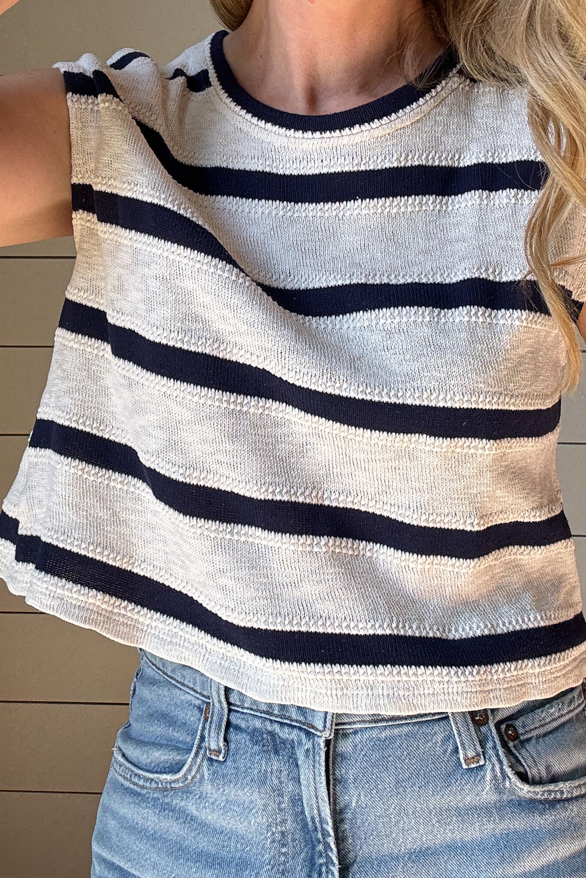 Effortlessly elevate your summer wardrobe with our Sleeveless Navy &amp; Cream Texture Knit Striped Top.

Made with a navy and cream textured knit, this top offers a casual yet stylish look.

With its loose fit and sleeveless design, it's the perfect choice for a comfortable and effortlessly chic outfit.