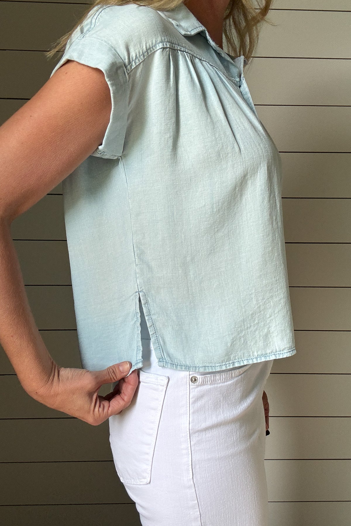 This button-front Tencel top is an easy grab for everyday style. Soft, breathable, and lightweight, it drapes beautifully and gives a polished look without any effort. Designed with a classic collar, full front buttons, and subtle side slits for a relaxed fit, it moves with you and hits just at the hips for a flattering finish. 