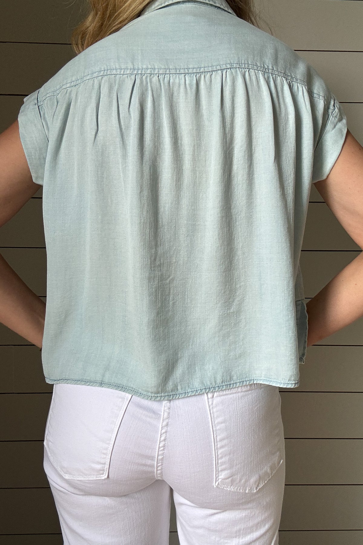 This button-front Tencel top is an easy grab for everyday style. Soft, breathable, and lightweight, it drapes beautifully and gives a polished look without any effort. Designed with a classic collar, full front buttons, and subtle side slits for a relaxed fit, it moves with you and hits just at the hips for a flattering finish. 