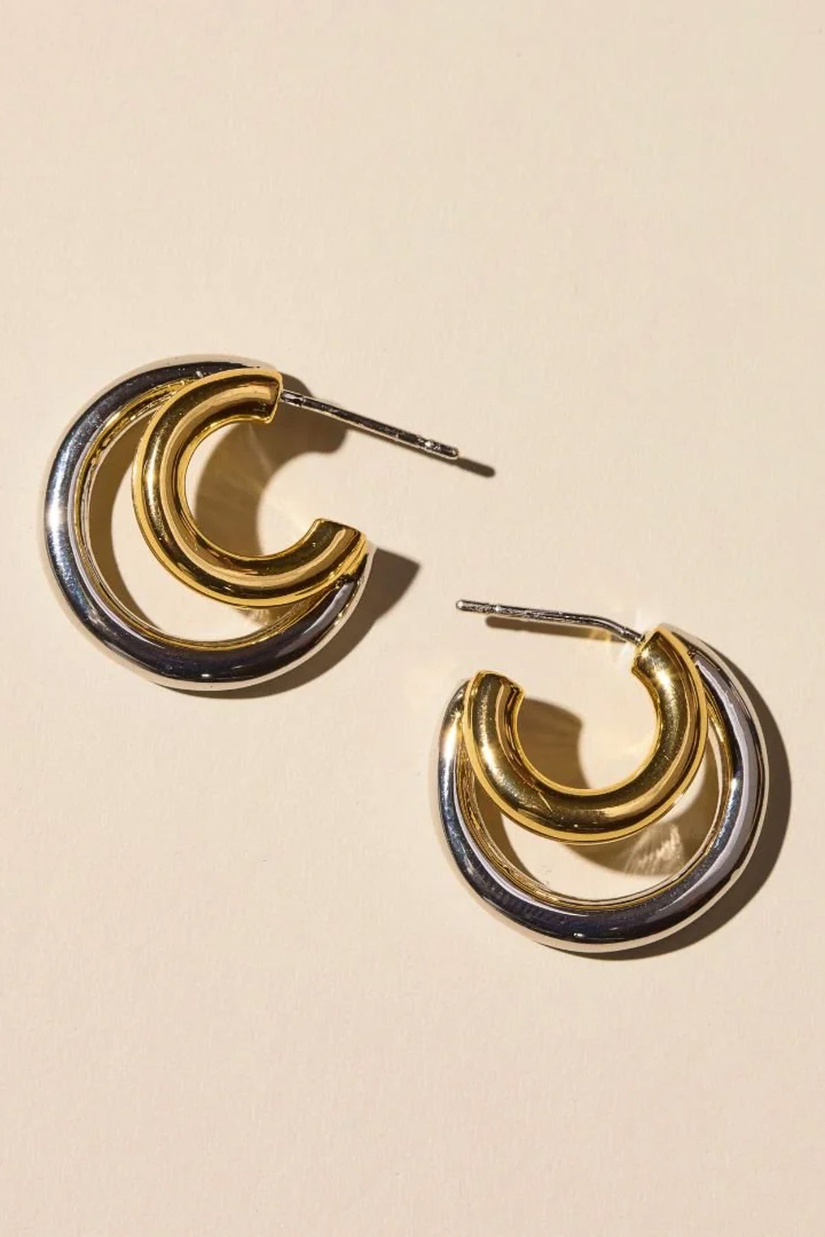 mixed metal double hoop earrings, double hoop illusion earrings, stacked look earrings, single piercing earrings, waterproof earrings, PVD plated jewelry, 14k gold plated earrings, nickel free earrings, hypoallergenic earrings, mixed metal jewelry, modern hoop earrings, everyday earrings, women’s fashion jewelry, boutique earrings, effortless style accessories, Cotton & Cashmere boutique, Blanco Texas boutique, women’s jewelry online