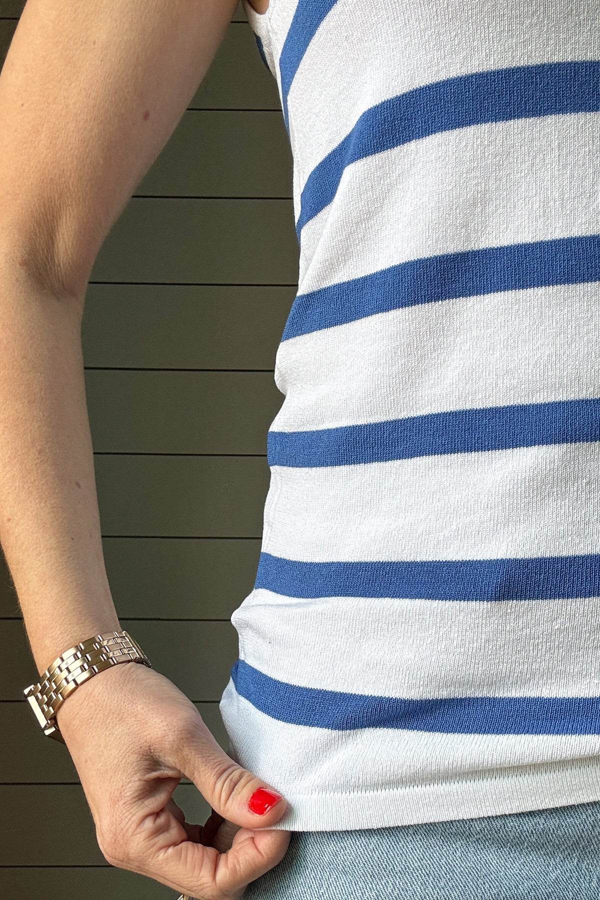 This blue and white striped knit tank is a fun, versatile piece you’ll wear on repeat! Slightly fitted for a flattering shape, it features a deep V-neckline in both the front and back, adding a feminine, breezy touch. The lightweight knit fabric feels soft and breathable, making it perfect for warm days or layering under your favorite denim jacket. The classic blue stripes against white make it easy to pair with anything from denim shorts to linen pants. Whether you’re headed out for a casual day or want so