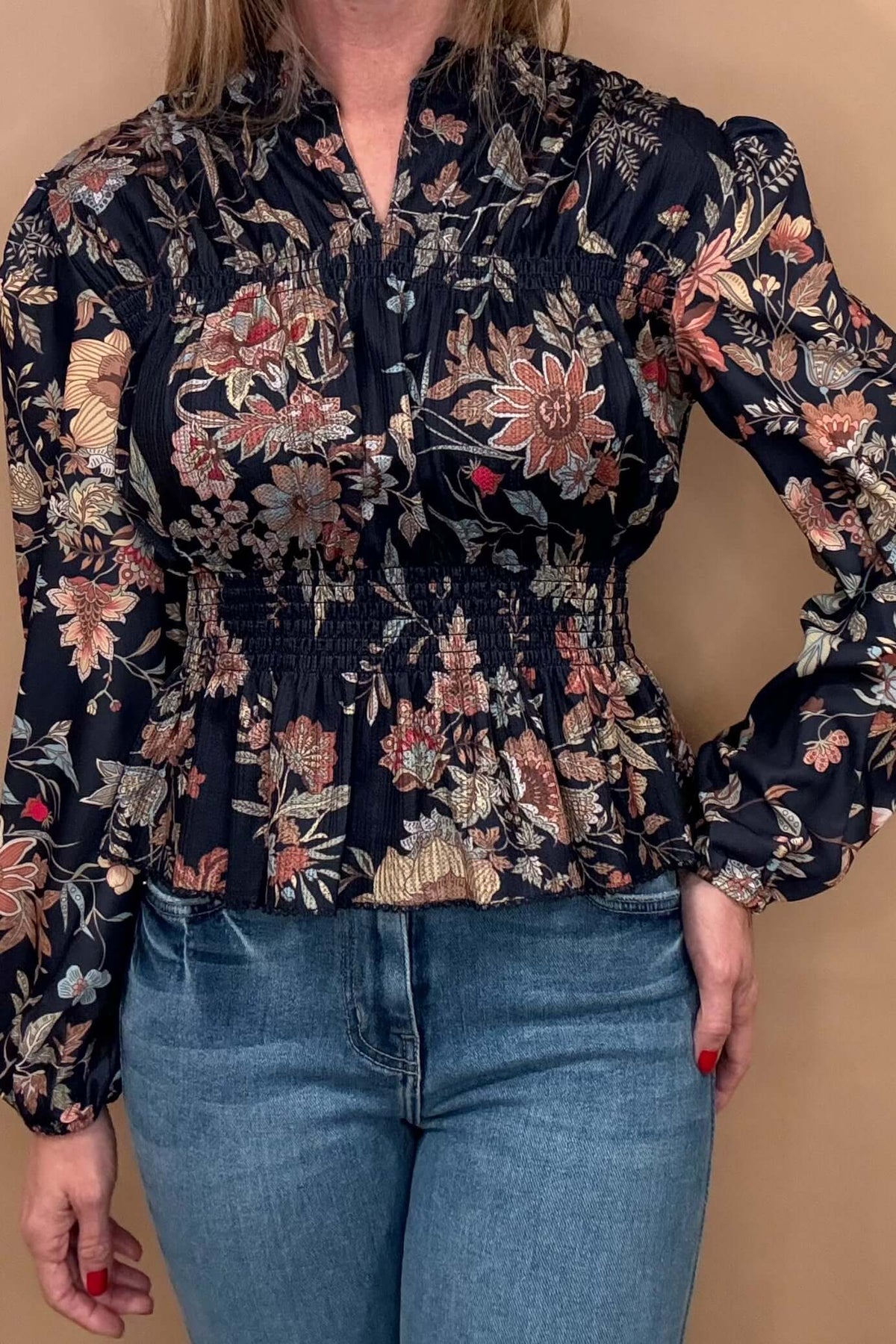 Embrace elegance and femininity with our Navy Floral Peplum. Featuring a split neck, delicate shoulder details, and gathered cuffs, peplum hem, this blouse is made from gorgeous floral fabric. Elevate your style and feel confident in this must-have piece.