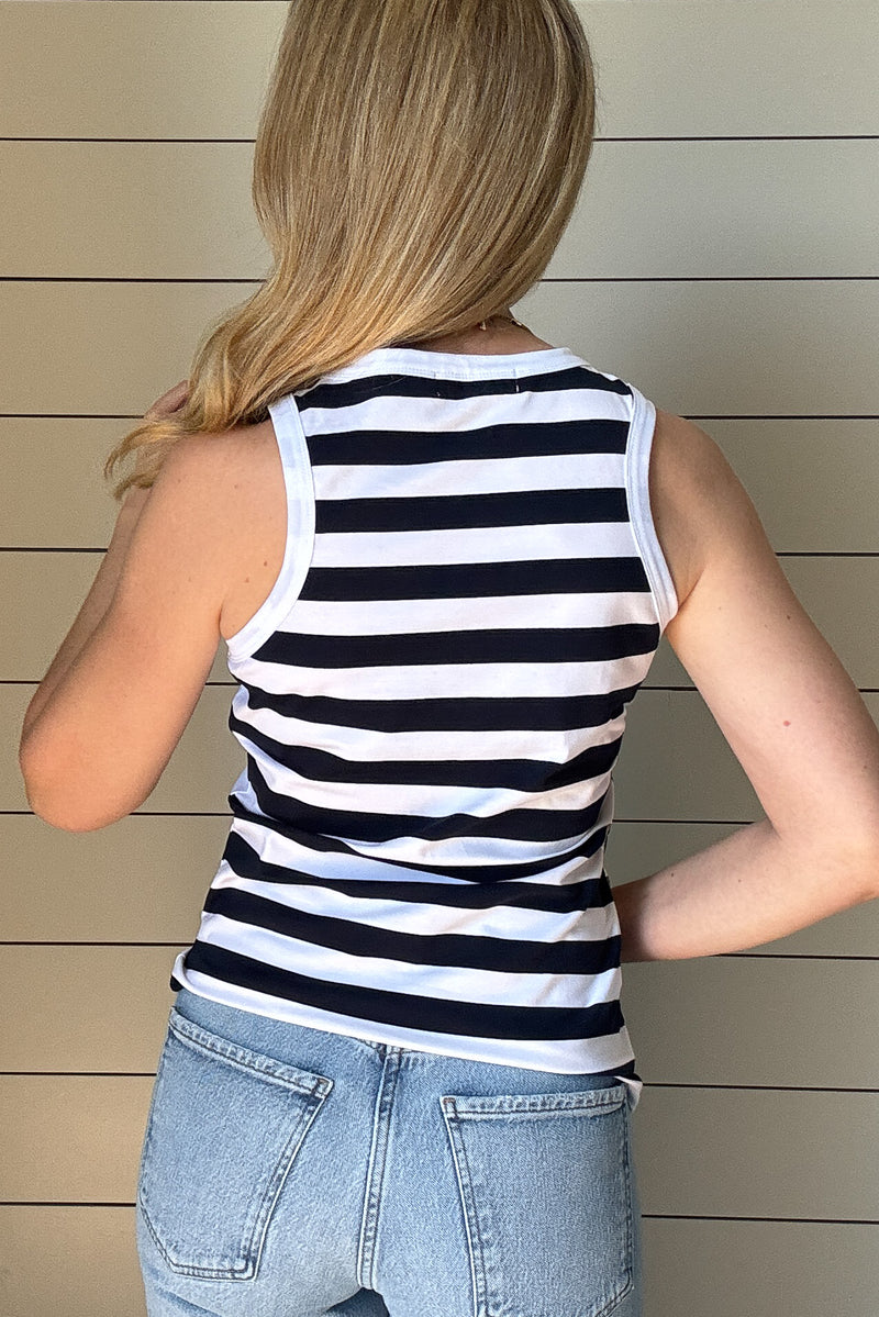 The classic Navy &amp; White Striped Tank is a must-have staple for effortless, everyday style. Made from a soft and breathable blend of 98% cotton and 2% spandex, this tank offers the perfect amount of stretch while maintaining its structured shape. The classic navy and white stripes bring a timeless, nautical-inspired vibe, making it an easy go-to for warm days and layering.