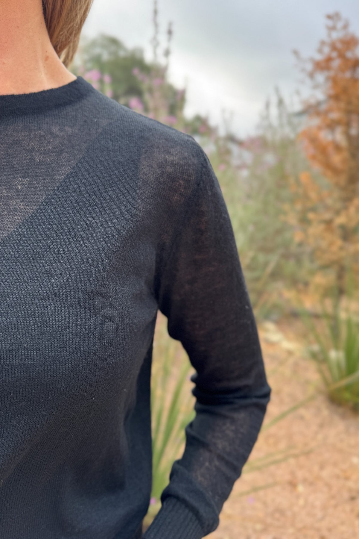 An elevated basic with an unexpected twist. This lightweight knit features a classic crew front and a modern crossover open-back detail. Soft with a hint of warmth, it’s perfect for layering over a tank or cami. Effortless with denim yet chic enough for a night out.