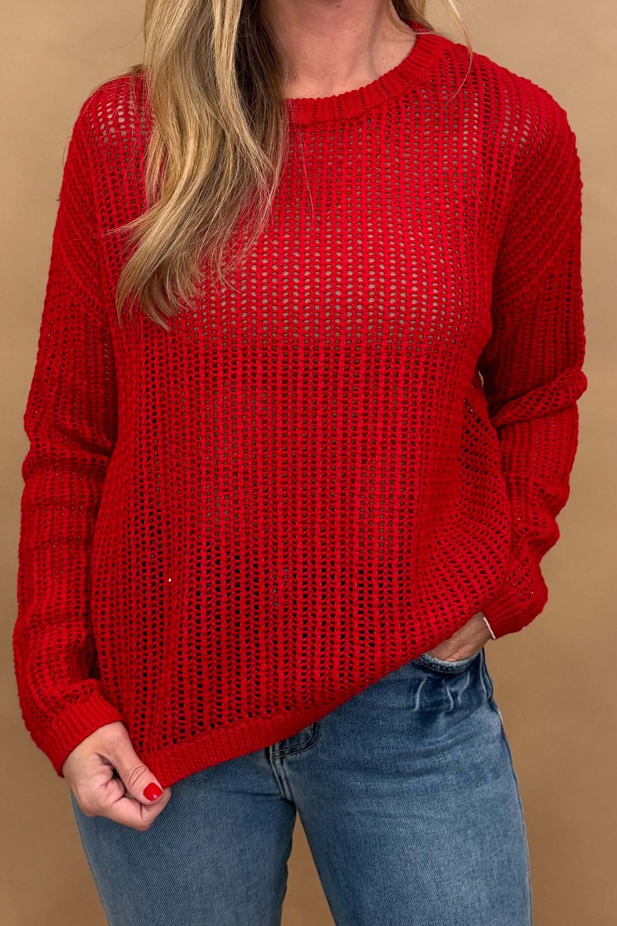 Add a pop of color to your wardrobe with our Red Open Knit Sweater. Made of 100% cotton, this long sleeve sweater is perfect for wearing with denim cut offs now, and transitioning to jeans for an effortless everyday look. Don't miss out on this fall must-have!