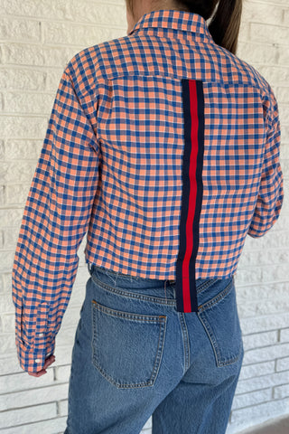 An upcycled men’s shirt reworked into a cropped, raw hem, easy silhouette that feels fresh and relaxed. Soft, feminine, and one-of-a-kind. Women's fashion boutique Blanco Texas Johnson City Texas