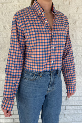 An upcycled men’s shirt reworked into a cropped, raw hem, easy silhouette that feels fresh and relaxed. Soft, feminine, and one-of-a-kind. Designed to be a one size fits most when worn open, wear it buttoned up and it fits like small or medium. Women's fashion boutique Blanco Texas Johnson City Texas