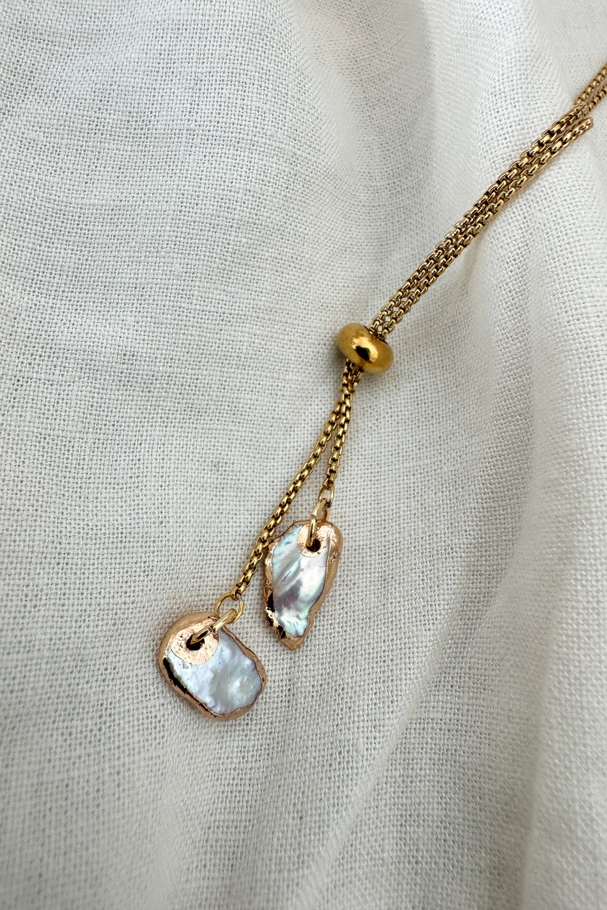 A timeless necklace that can be worn alone or layered for a dramatic look. Made in the USA.

natural baroque pearl
18k gold plated
over stainless steel
water proof
nickel / lead free
made in the USA with materials ethically sourced