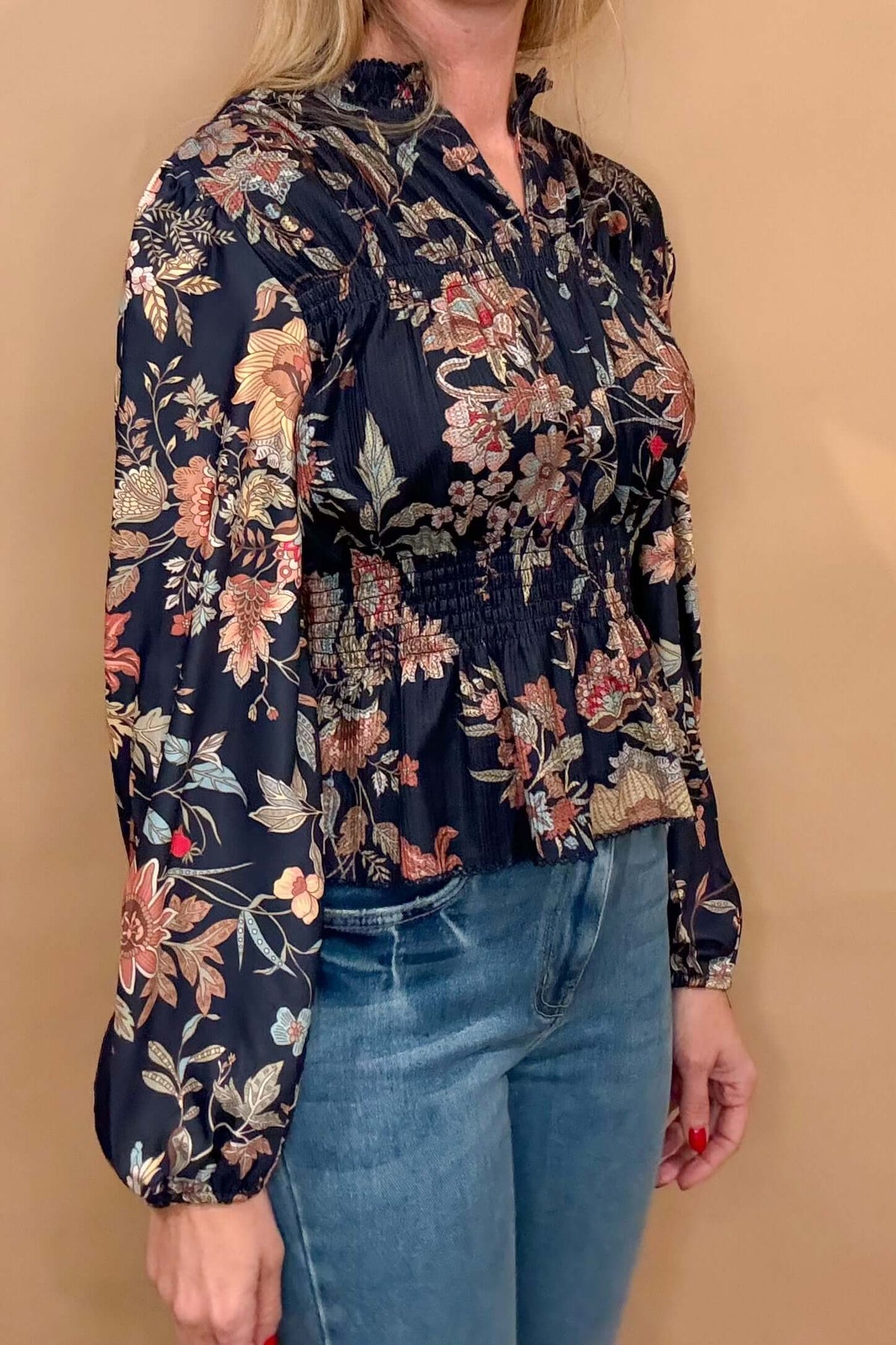 Embrace elegance and femininity with our Navy Floral Peplum. Featuring a split neck, delicate shoulder details, and gathered cuffs, peplum hem, this blouse is made from gorgeous floral fabric. Elevate your style and feel confident in this must-have piece.