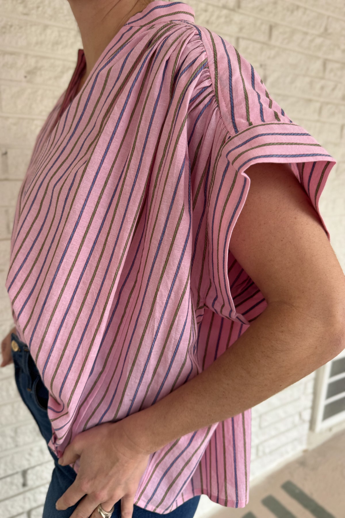 This lightweight striped top is an easy go to for polished everyday style! Designed in France, it features a flattering split neckline and relaxed dolman sleeves that drape beautifully without feeling oversized. The soft cotton fabric feels breathable and comfortable, making it perfect for warm days or easy layering under a jacket. The subtle stripe pattern adds interest while staying timeless, so you can dress it up for work or keep it casual with denim. An effortless piece you will reach for again and aga