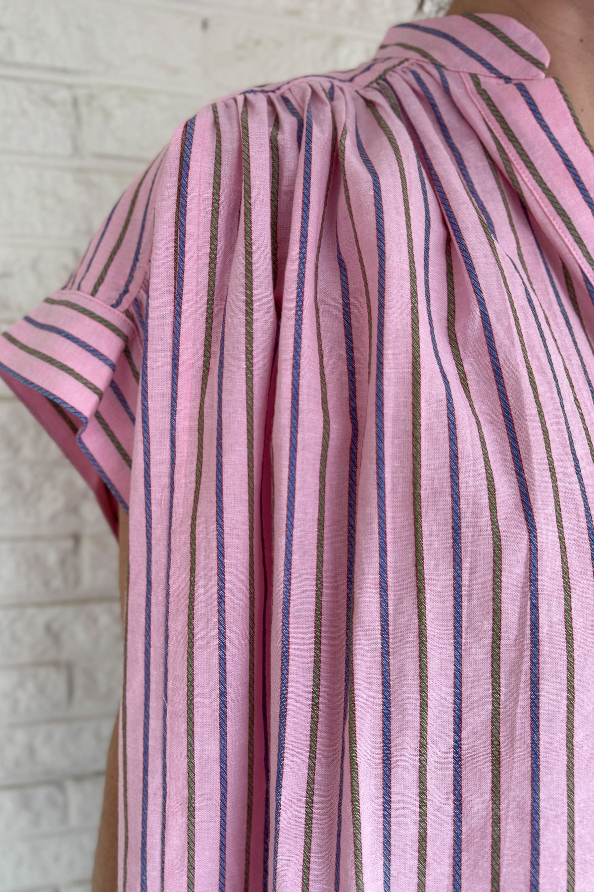 This lightweight striped top is an easy go to for polished everyday style! Designed in France, it features a flattering split neckline and relaxed dolman sleeves that drape beautifully without feeling oversized. The soft cotton fabric feels breathable and comfortable, making it perfect for warm days or easy layering under a jacket. The subtle stripe pattern adds interest while staying timeless, so you can dress it up for work or keep it casual with denim. An effortless piece you will reach for again and aga