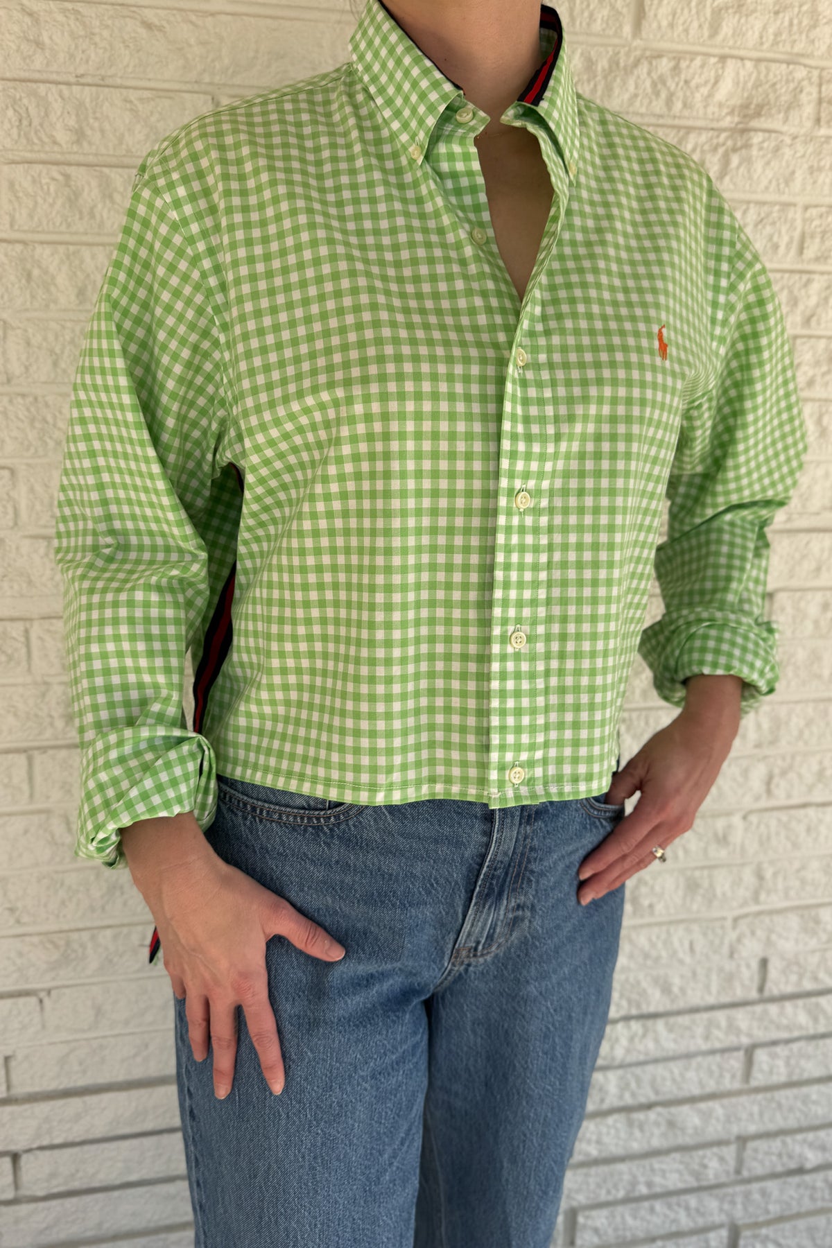 The modern Stormy button-down is designed to move with you for an easy, elevated feel. The cropped front flows into a longer back for a flattering high-low shape that adds interest to a classic style. Finished details give this piece a polished look that works dressed up or casual.