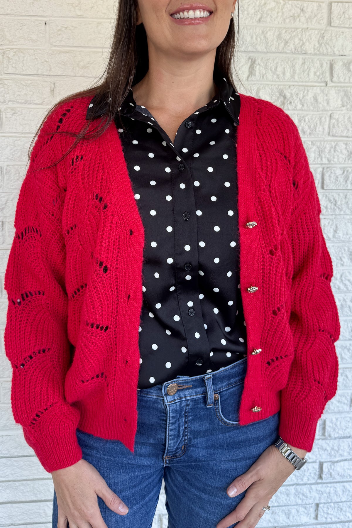 This openwork knit cardigan is a relaxed layer with an effortless drape. Designed in an oversized, straight cut with wide sleeves, it gives a cozy yet modern feel. The plunging V-neckline and metallic button closure add chic details that elevate this everyday piece.