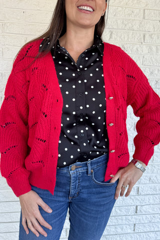 This openwork knit cardigan is a relaxed layer with an effortless drape. Designed in an oversized, straight cut with wide sleeves, it gives a cozy yet modern feel. The plunging V-neckline and metallic button closure add chic details that elevate this everyday piece.