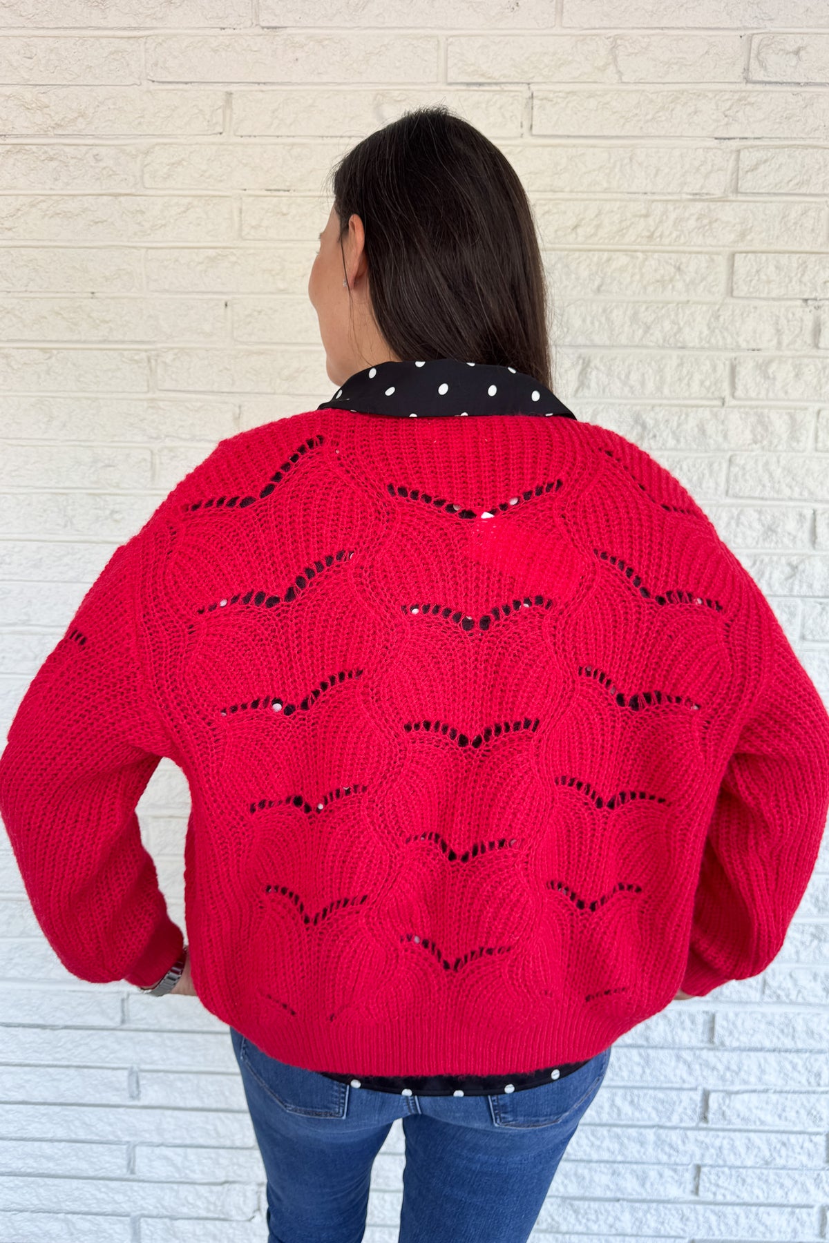 This openwork knit cardigan is a relaxed layer with an effortless drape. Designed in an oversized, straight cut with wide sleeves, it gives a cozy yet modern feel. The plunging V-neckline and metallic button closure add chic details that elevate this everyday piece.