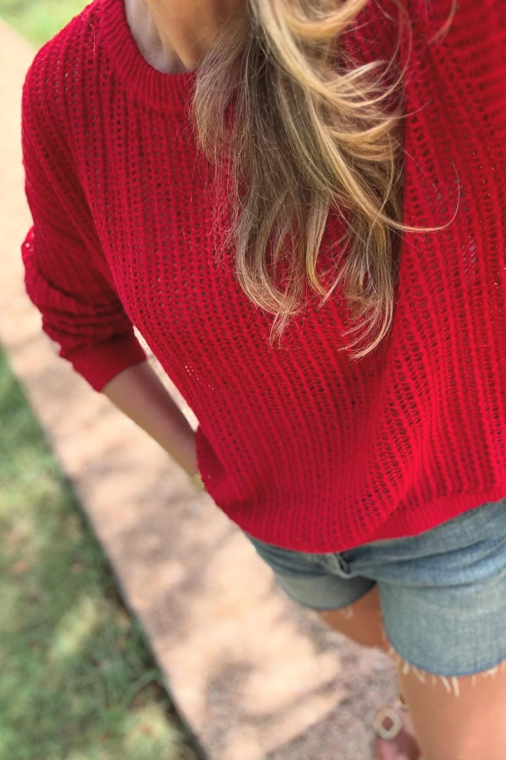 Add a pop of color to your wardrobe with our Red Open Knit Sweater. Made of 100% cotton, this long sleeve sweater is perfect for wearing with denim cut offs now, and transitioning to jeans for an effortless everyday look. Don't miss out on this fall must-have!