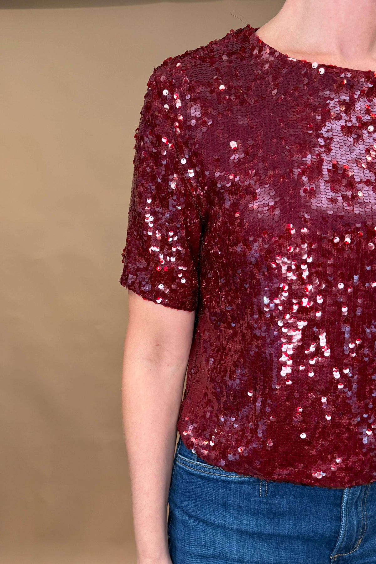 Get ready to shine in our Louise Sequin Tee! This burgundy wine top was designed in France by our favorite French brand, Suncoo, and it is perfect for any occasion. Dress it down with distressed jeans or go all out glam with faux leather pants. Lined for comfort &amp; slightly stretchy for ease of wear, you'll love the versatile style of this sequin tee. Order now and sparkle all day long!