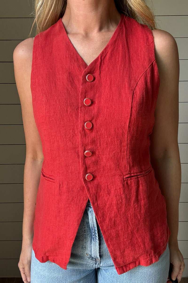 A bold yet easy layering piece, this chili red vest brings structure and effortless style to any look. Lightweight and breathable, it works well on its own or layered over a tee. The tailored cut flatters without feeling too stiff, and the rich color adds a fun pop to your wardrobe.