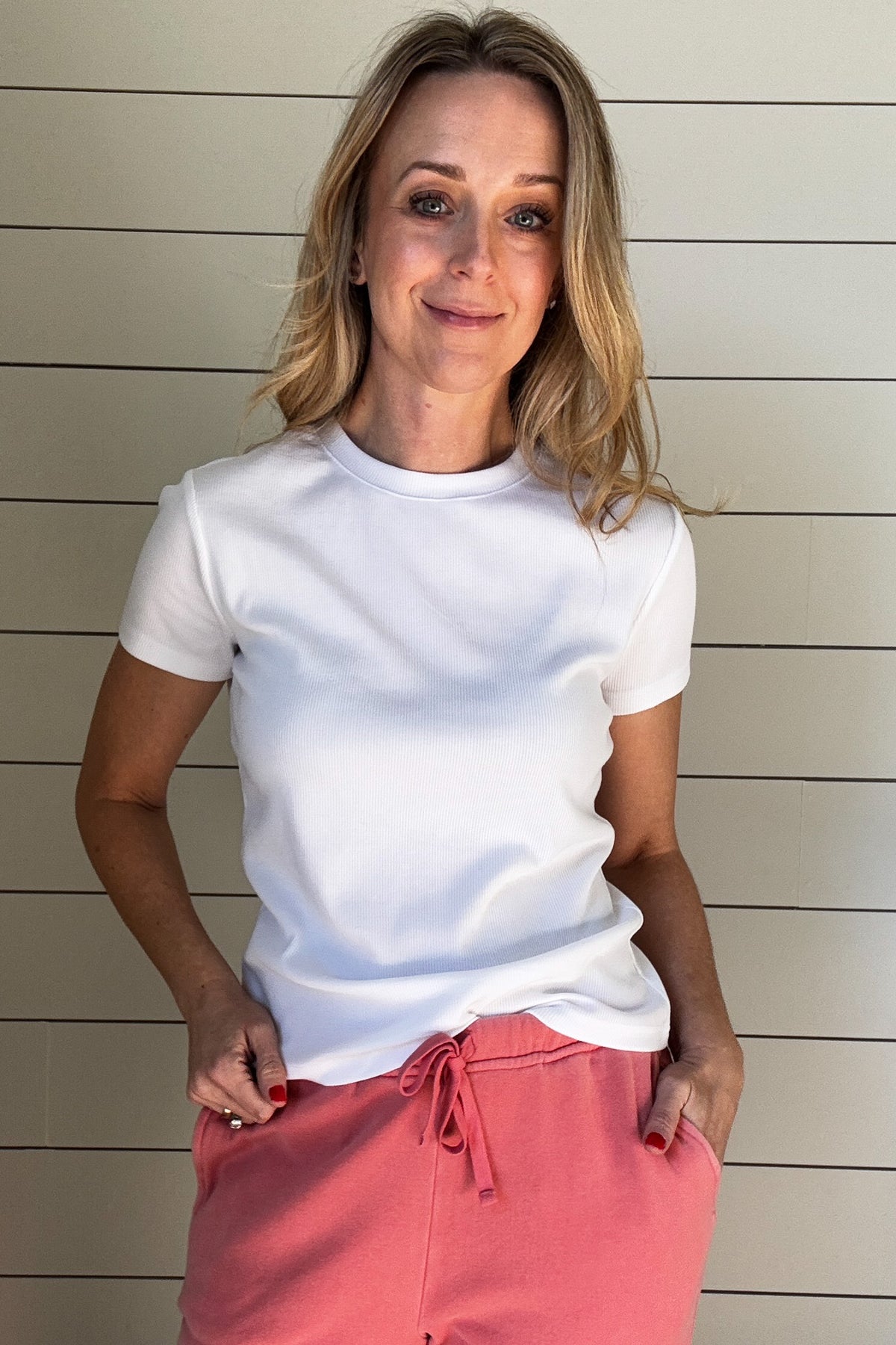 Get ready for spring with this must-have Ribbed White Tee Shirt! The ribbing adds coverage for a flattering fit, while the fitted shoulders and slightly looser torso create a dreamy silhouette. Perfect for any occasion, this is a wardrobe must have for your closet.