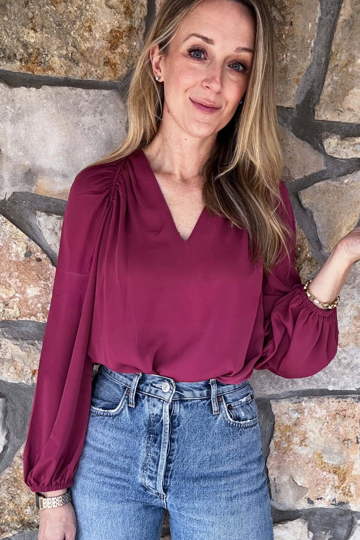 Embrace elegance and femininity with our Rouge Blush Blouse. Featuring a split neck, delicate shoulder details, and gathered cuffs, this blouse is made from gorgeous flowing fabric. Elevate your style and feel confident in this must-have piece.