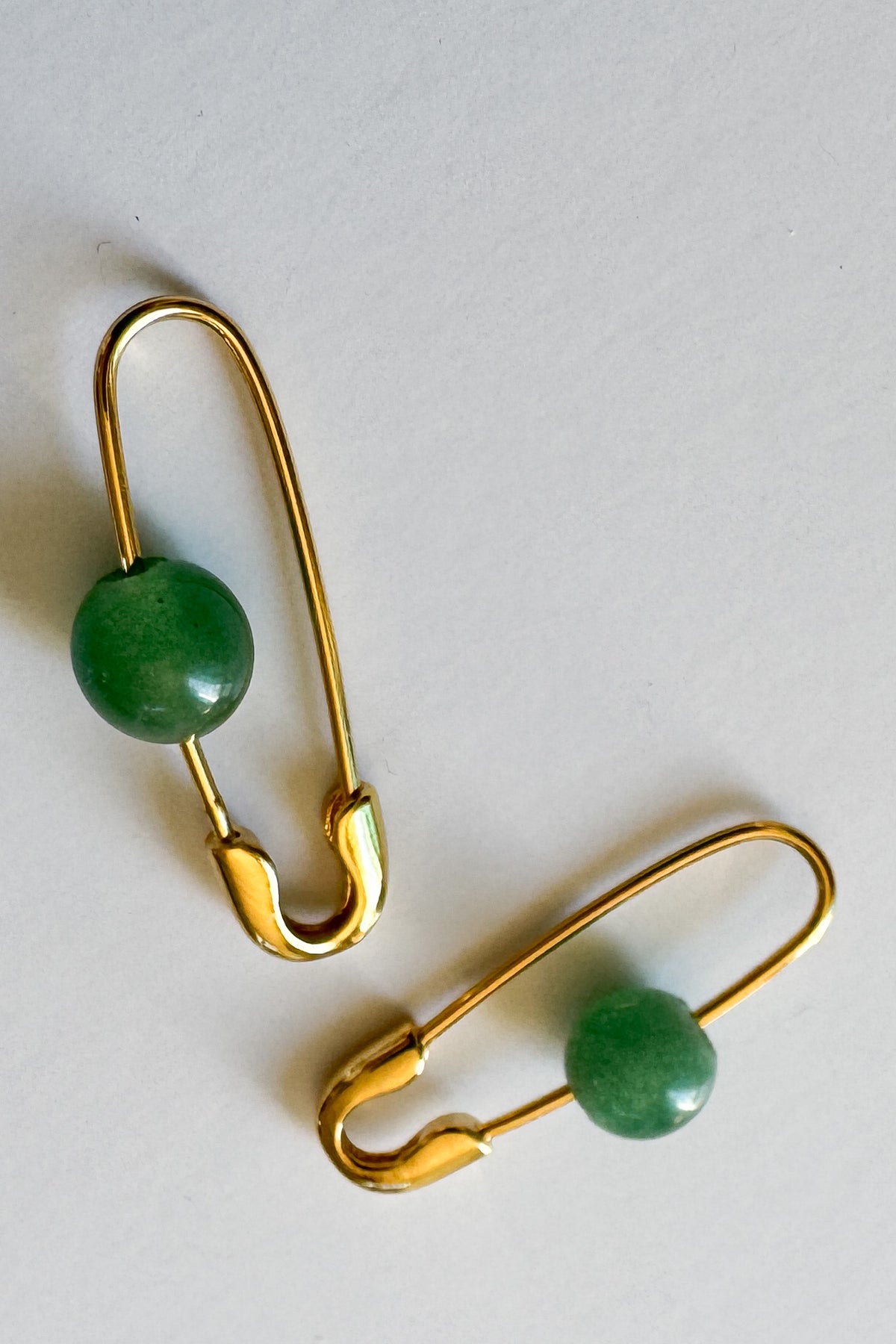 Our Roxy Stone Safety Pin Earring offers eye catching style with its aventurine stone and fully functioning safety pin motif.
18k gold plated over stainless steel
water proof

nickel / lead free
made in the USA with materials ethically sourced from Turkey