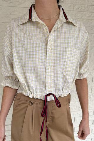 An upcycled men’s shirt reworked into a cropped, finished hem, easy silhouette that feels fresh and relaxed. Soft, breathable, and one-of-a-kind. Designed to be a one size fits most, this blouse fits sizes small to large. Women's fashion boutique Blanco Texas