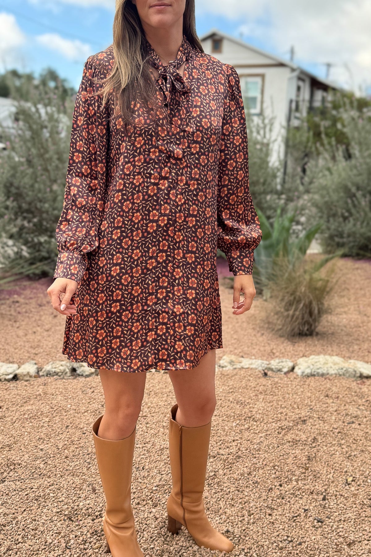 &nbsp;A fresh pop of autumn blooms makes this 34" dress a standout for any occasion. Designed in soft 100% viscose, it flows effortlessly with a relaxed silhouette and features a feminine tie-neck detail for an added touch of charm.