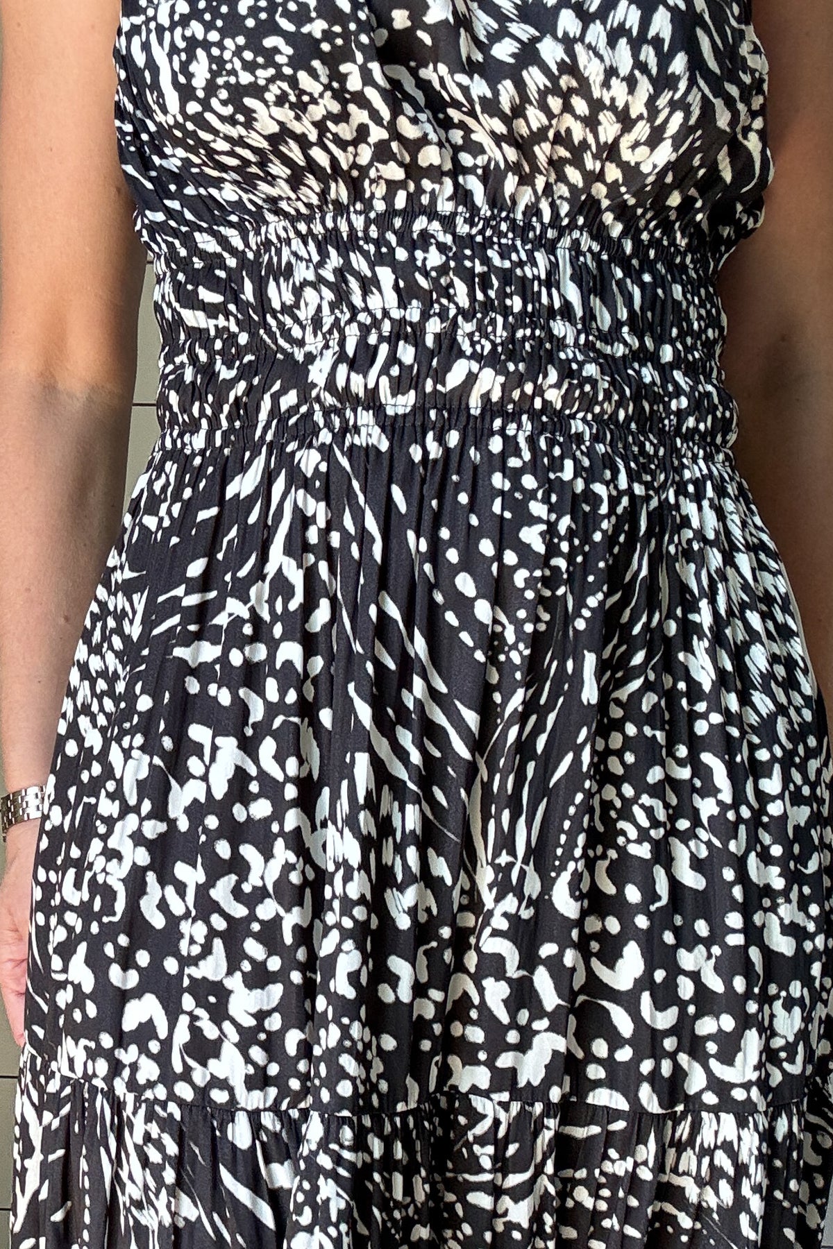 &nbsp;Make a statement with this sleek and modern one-shoulder dress. The satin fabric gives it just the right amount of sheen, while the black and white abstract print adds a bold twist. It’s unlined and lightweight—perfect for summer nights or dressing up your everyday. The smocked waist keeps things flattering, and yes—it has pockets. Wear it with slides or a strappy heel and you're good to go.