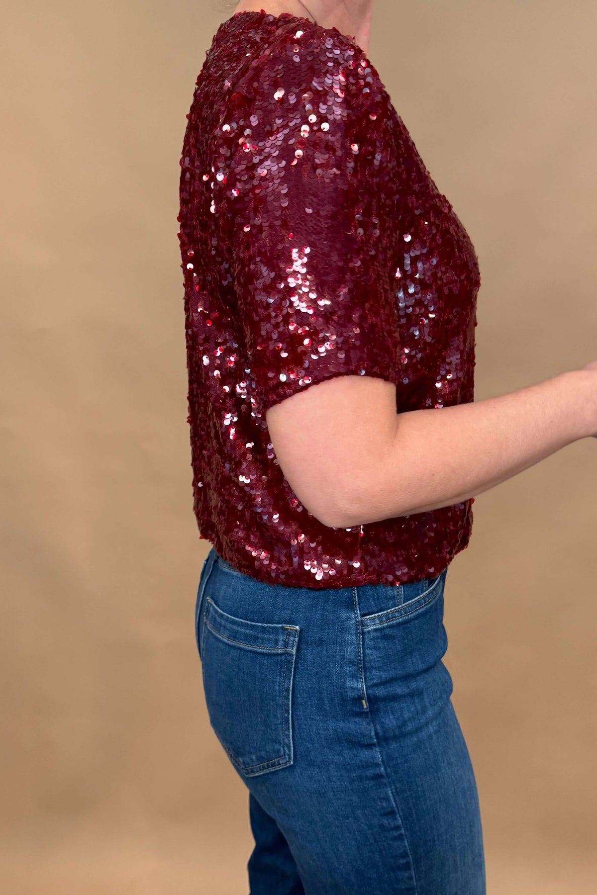 Get ready to shine in our Louise Sequin Tee! This burgundy wine top was designed in France by our favorite French brand, Suncoo, and it is perfect for any occasion. Dress it down with distressed jeans or go all out glam with faux leather pants. Lined for comfort &amp; slightly stretchy for ease of wear, you'll love the versatile style of this sequin tee. Order now and sparkle all day long!