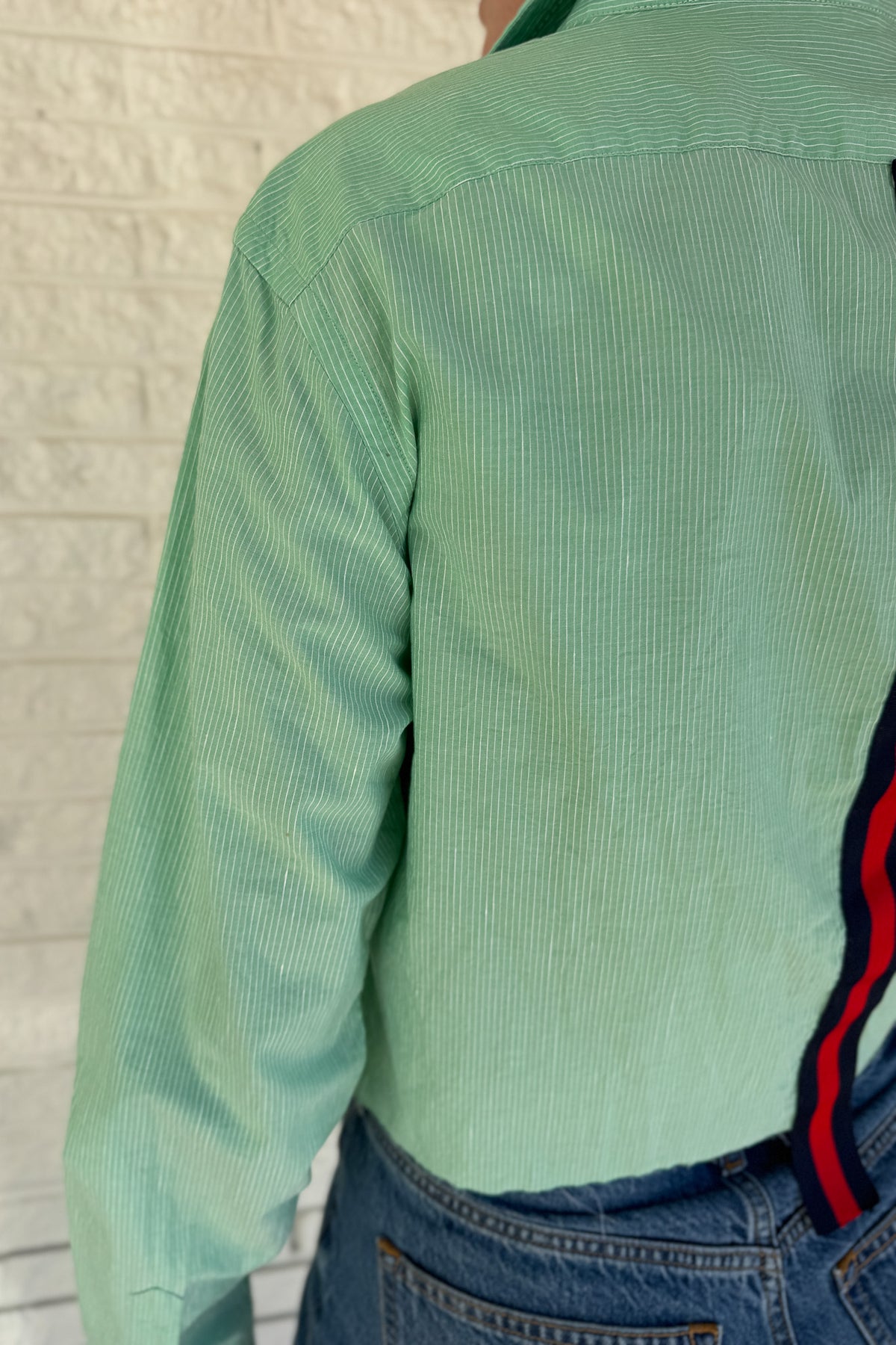 An upcycled men’s shirt reworked into a cropped, raw hem, easy silhouette that feels fresh and relaxed. Soft, feminine, and one-of-a-kind. Designed to be a one size fits most when worn open, wear it buttoned up and it fits like small or medium.