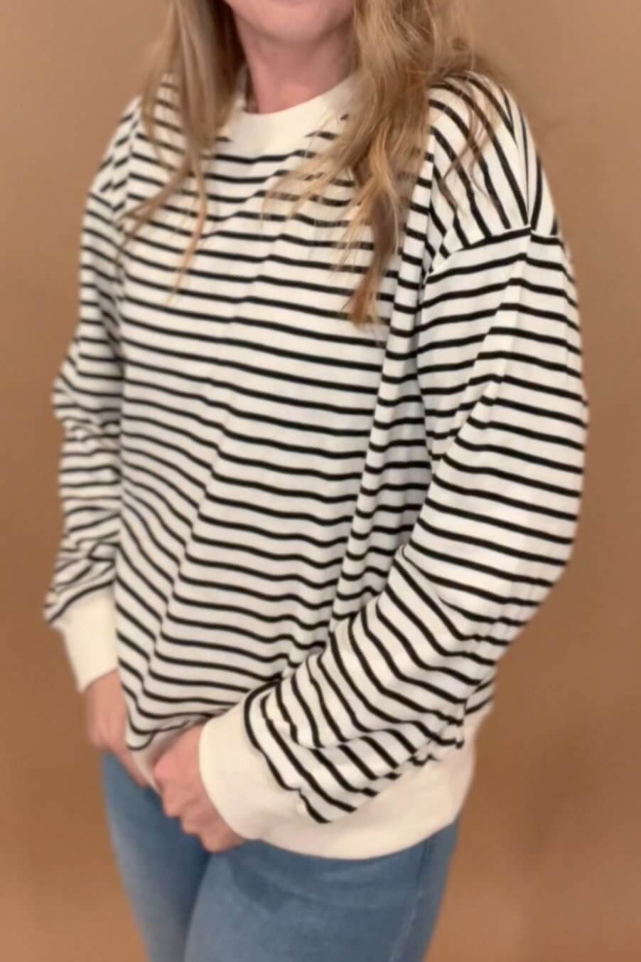 This luxurious Weekly Sweatshirt is made using the softest fabrics, making it an ideal choice for those who demand the highest quality and comfort. Its black and ecru striped design is accented with ecru banding on hem cuffs and neckline for a look that is modern and tasteful. It's a garment you'll want to wear again and again.