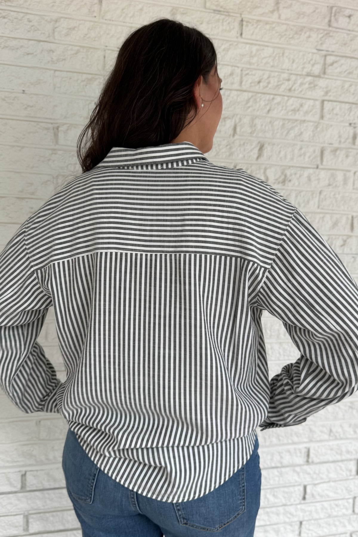 A customer favorite is back! This best-selling striped button-down blend of 51% cotton with 49% polyester for a soft yet crisp feel. The classic vertical stripes and relaxed fit make it perfect for easy, everyday style.