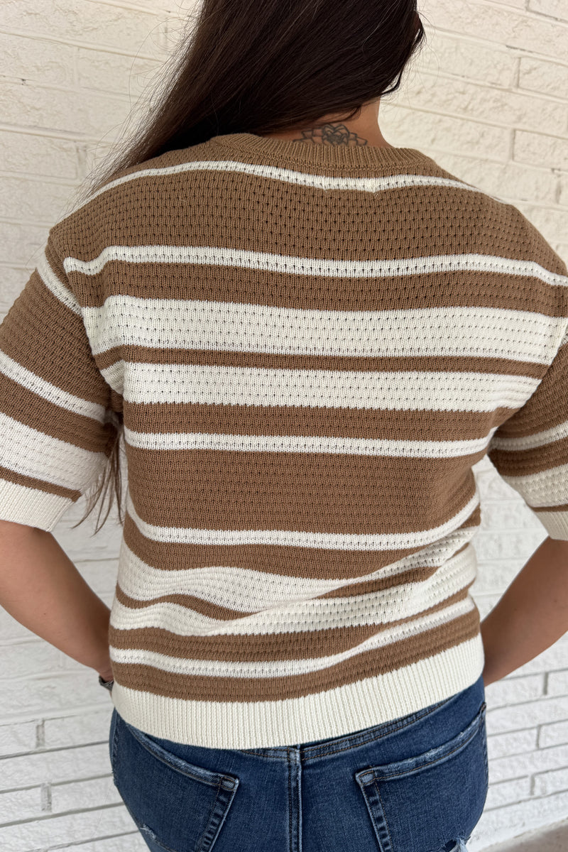 Classic stripes meet everyday comfort in this 100% cotton knit top. With its breathable open-knit texture and short sleeves, it’s an easy choice for effortless clothing that works from season to season. A timeless neutral palette keeps it versatile for everyday wear.