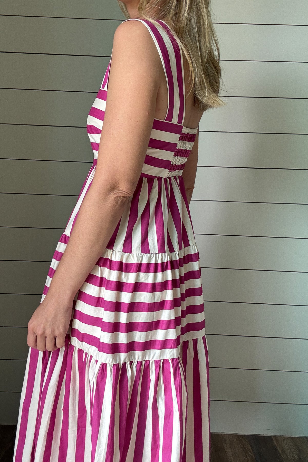 &nbsp;This dress brings all the joy. With bold pink and white stripes and a playful tiered skirt, it’s made for sunshine and smiles. The wide straps and square neckline give it a flattering, modern shape while the lined cotton fabric keeps it breezy and comfortable. No pockets means a smooth, easy fit—just add sandals and go.