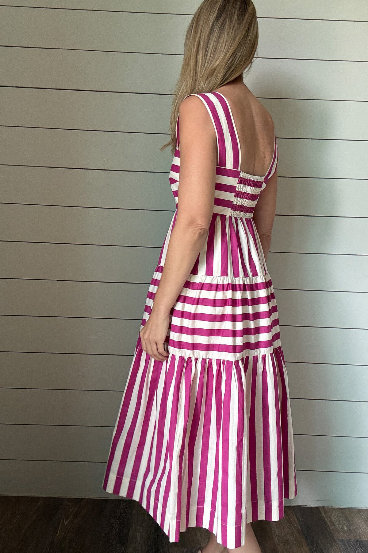 &nbsp;This dress brings all the joy. With bold pink and white stripes and a playful tiered skirt, it’s made for sunshine and smiles. The wide straps and square neckline give it a flattering, modern shape while the lined cotton fabric keeps it breezy and comfortable. No pockets means a smooth, easy fit—just add sandals and go.