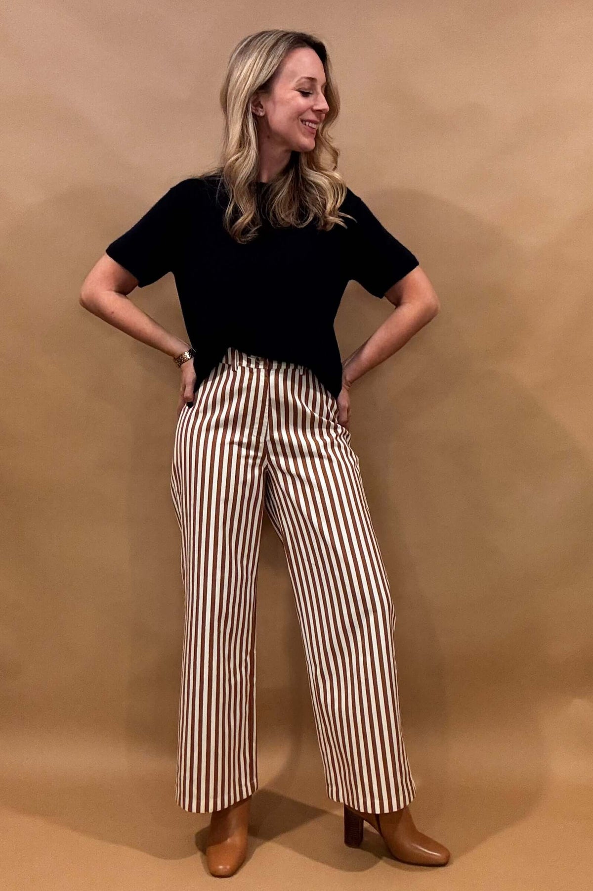 Introducing our Striped Wide Leg Pants, the perfect balance of style and comfort! The vertical stripes create a flattering elongated look, while the elastic back waist and belt loops provide a customizable fit. Button and zip closure with five pockets, these pants offer both functionality and fashion. Lightweight fabric so no bulk with these pants.