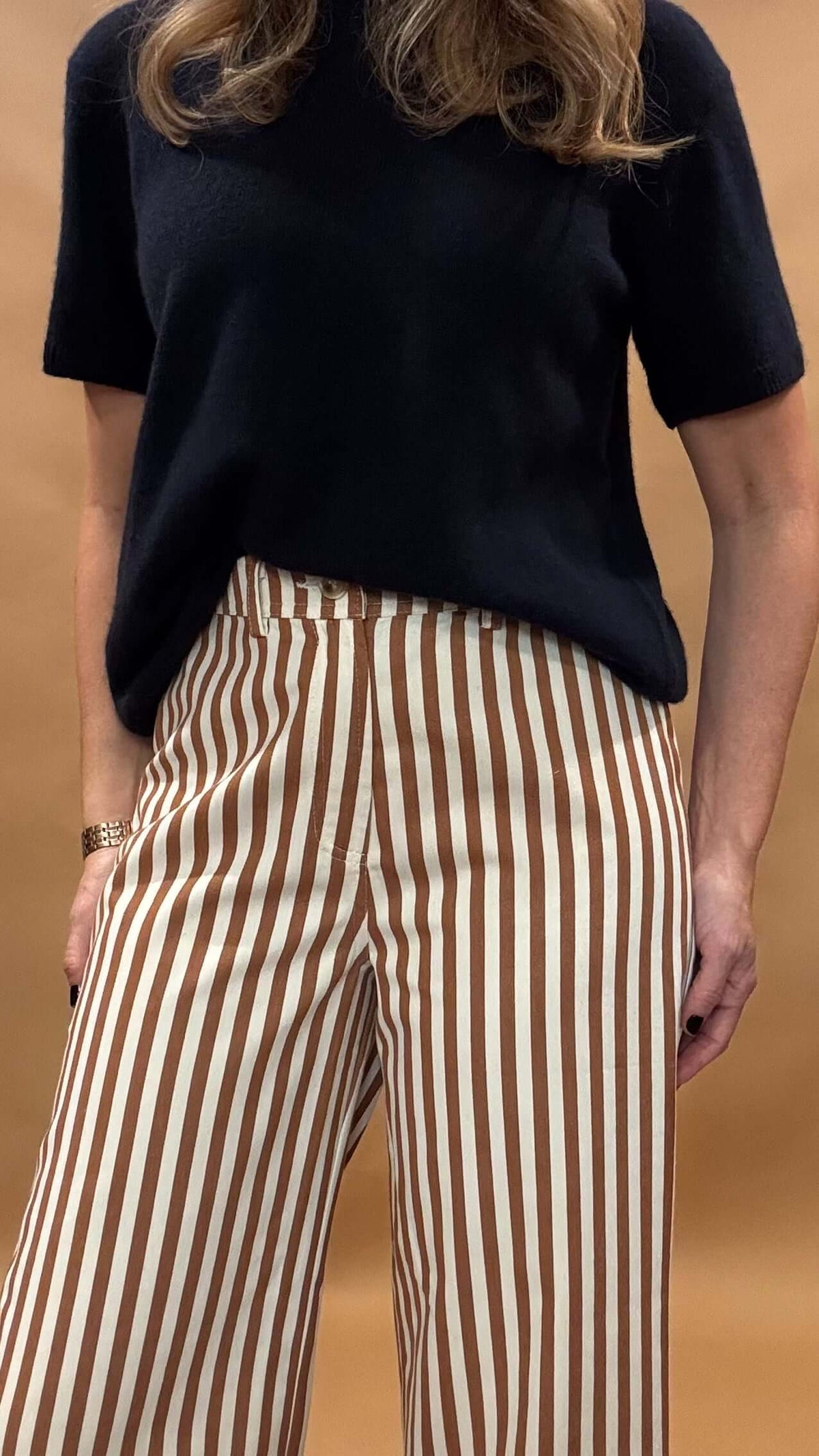 Introducing our Striped Wide Leg Pants, the perfect balance of style and comfort! The vertical stripes create a flattering elongated look, while the elastic back waist and belt loops provide a customizable fit. Button and zip closure with five pockets, these pants offer both functionality and fashion. Lightweight fabric so no bulk with these pants.