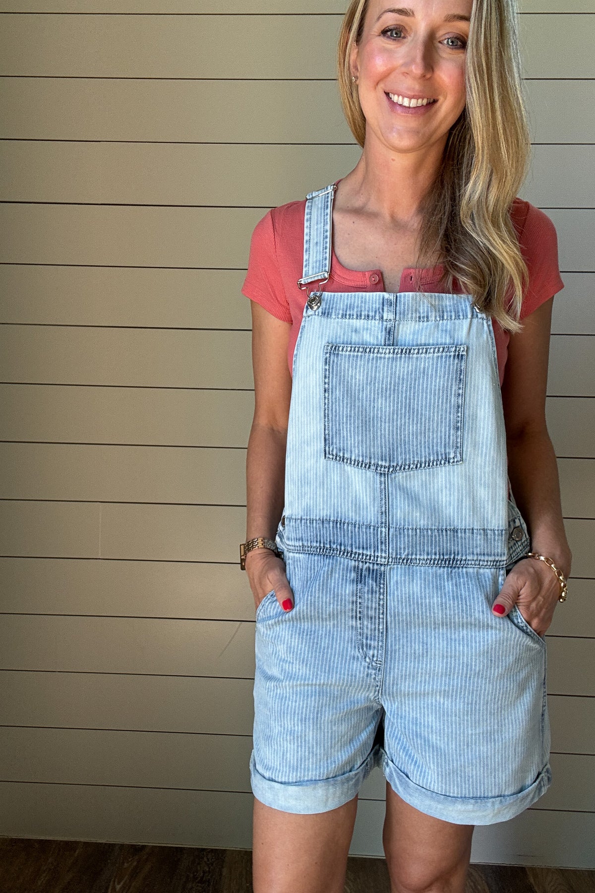 
Laid-back and cute without trying too hard. These light-wash striped shortalls are made for summer days. With a relaxed fit, front chest pocket, and tacked rolled cuffs, they strike the perfect balance of casual and polished. Adjustable straps let you customize your fit, and side buttons make them easy to slip on and go. Pair with any tank or tee for a playful, easy outfit.