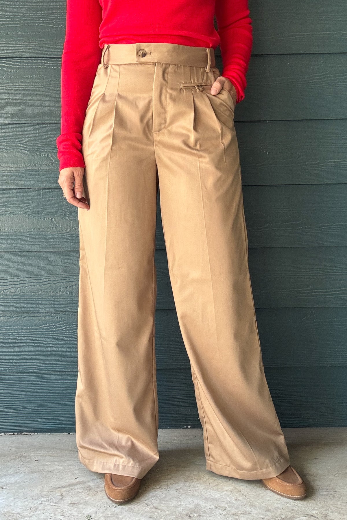 Women’s tan pleated wide leg pants with high waist, front pockets and tailored trouser fit at Cotton & Cashmere boutique in Blanco, Texas.