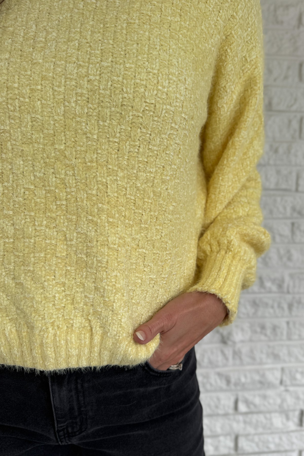 Soft, cheerful, and effortlessly cozy — this braided knit sweater adds a touch of sunshine to cool days. Its subtle checkered texture gives it dimension, while the classic crew neckline and ribbed edges keep it timeless. Easy to pair with denim or skirts for a bright, everyday look.