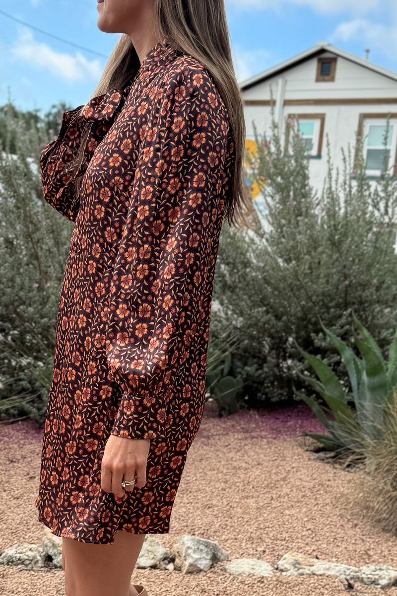 &nbsp;A fresh pop of autumn blooms makes this 34" dress a standout for any occasion. Designed in soft 100% viscose, it flows effortlessly with a relaxed silhouette and features a feminine tie-neck detail for an added touch of charm.