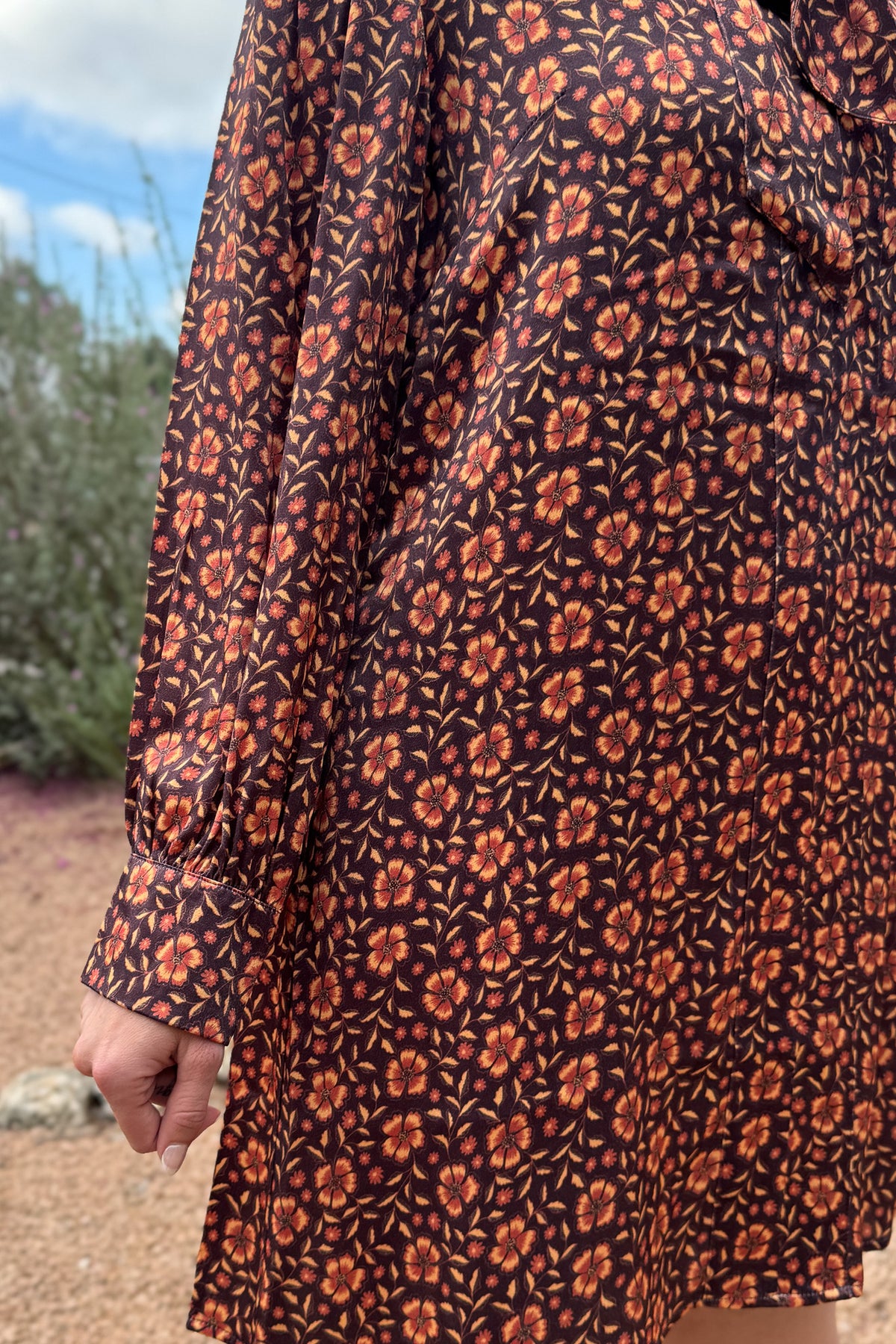 &nbsp;A fresh pop of autumn blooms makes this 34" dress a standout for any occasion. Designed in soft 100% viscose, it flows effortlessly with a relaxed silhouette and features a feminine tie-neck detail for an added touch of charm.